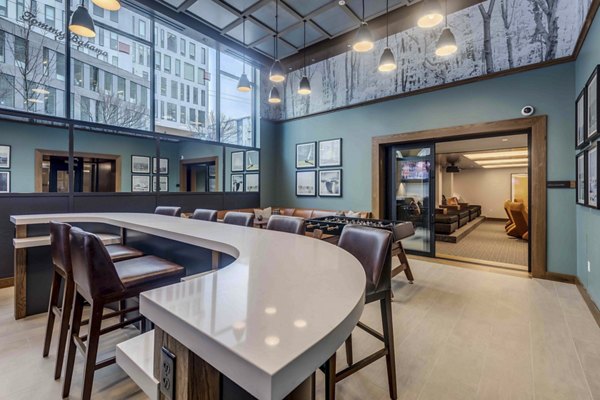 Marlowe Apartments: Stylish clubhouse with modern furnishings and communal seating area