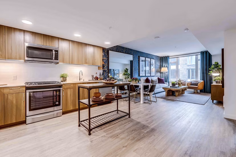 Modern kitchen with stainless steel appliances and quartz countertops at Marlowe Apartments