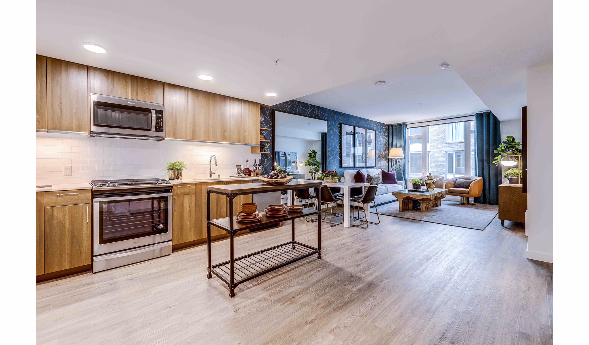 Modern kitchen with stainless steel appliances and quartz countertops at Marlowe Apartments