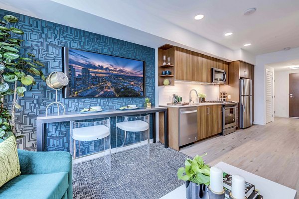 Modern kitchen with stainless steel appliances at Marlowe Apartments luxury units in vibrant urban setting