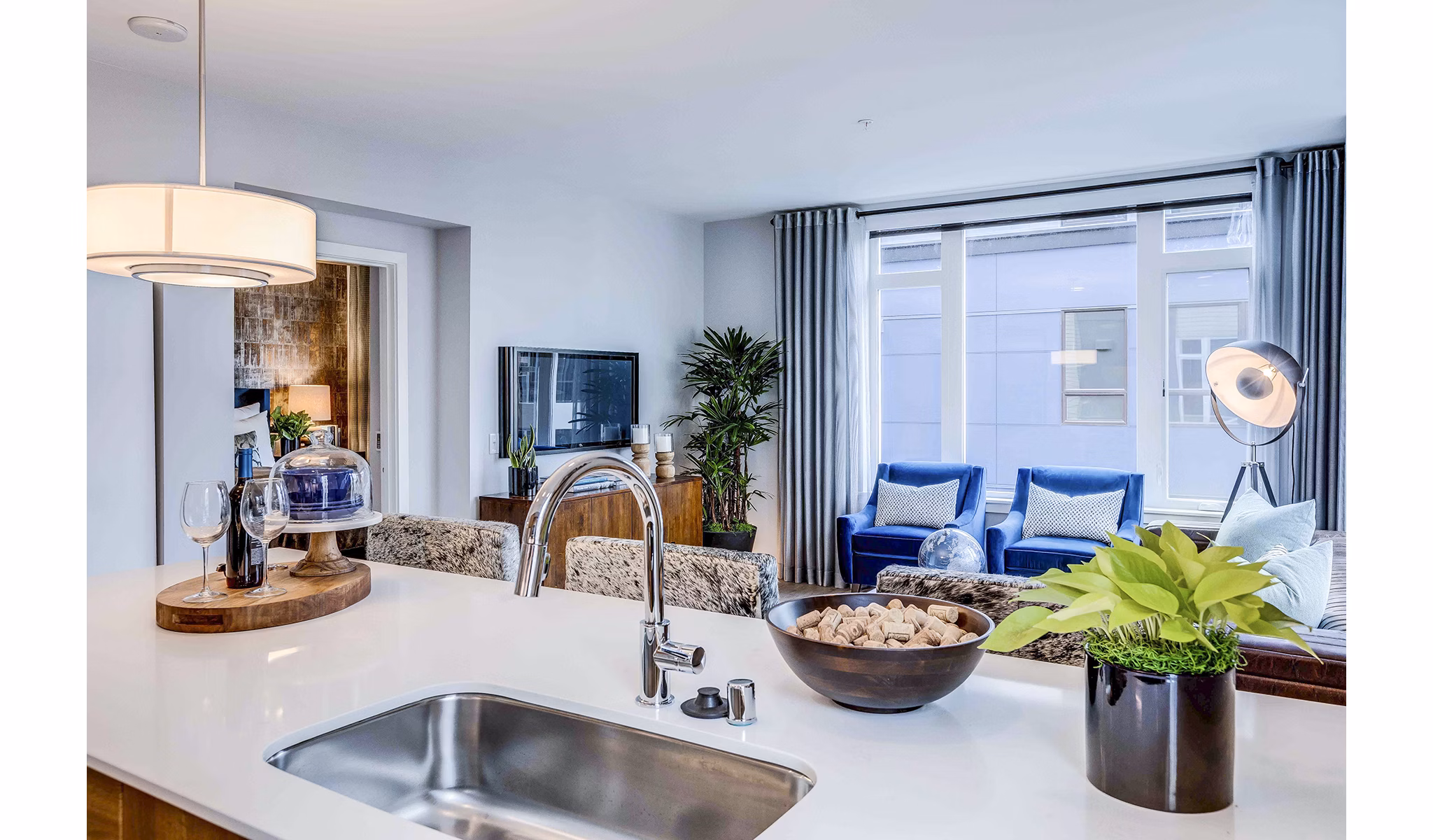 Modern kitchen with stainless steel appliances and granite countertops in Marlowe Apartments luxury residence