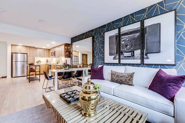 Cozy living room with modern dÃ©cor and ample natural light at Marlowe Apartments