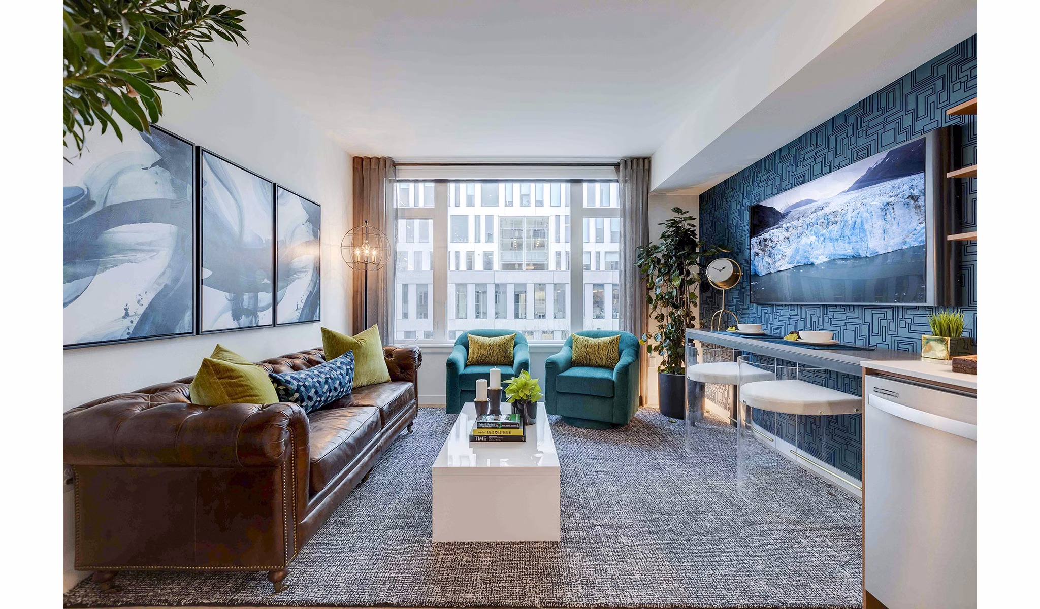 Spacious living room featuring elegant furnishings and natural light at Marlowe Apartments