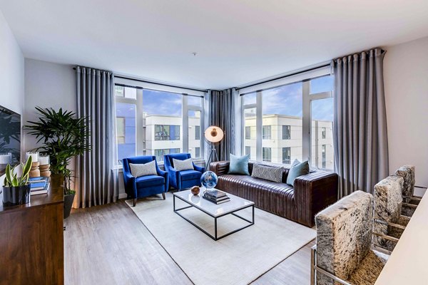 Spacious living room with modern decor at Marlowe Apartments