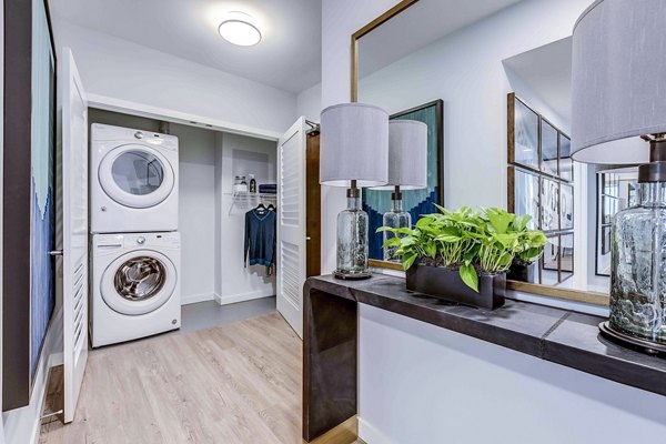 Laundry room featuring modern appliances at Marlowe Apartments in luxury Greystar community
