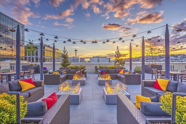 Modern rooftop deck with seating areas at Marlowe Apartments featuring expansive city views
