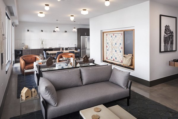 Modern clubhouse with stylish seating at Alexan LoHi Apartments