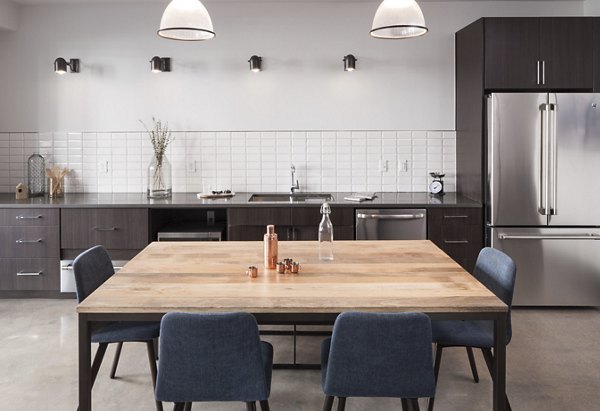 Modern clubhouse featuring cozy seating and a fireplace at Alexan LoHi Apartments, luxury community in Denver