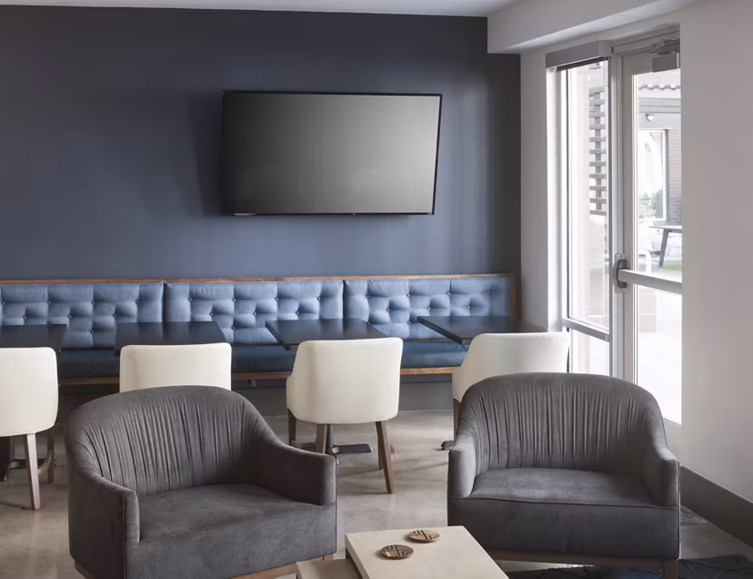 Modern clubhouse with sleek decor at Alexan LoHi Apartments offering luxury living in Denver