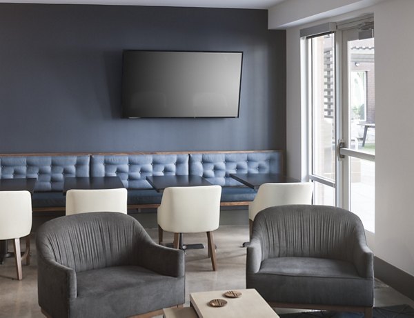 Modern clubhouse with sleek decor at Alexan LoHi Apartments offering luxury living in Denver