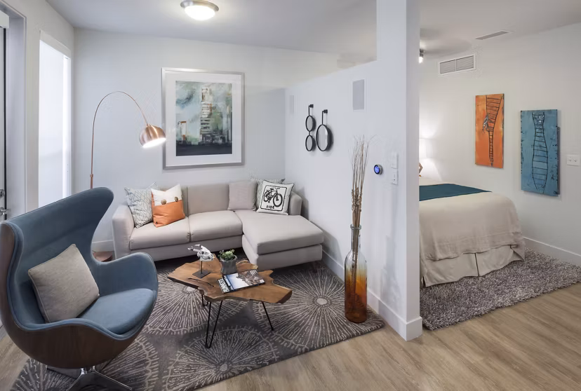 Modern kitchen with stainless steel appliances in Alexan LoHi Apartments