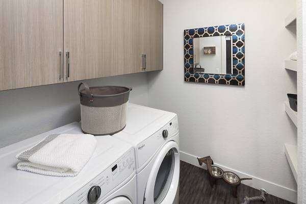 laundry room at Alexan LoHi Apartments