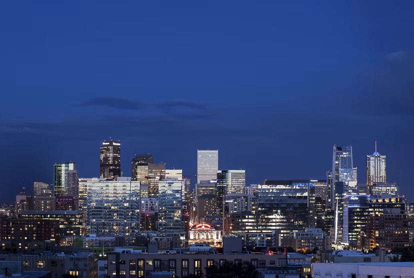 Cityscape view from high-rise balcony at Alexan LoHi Apartments in Denver