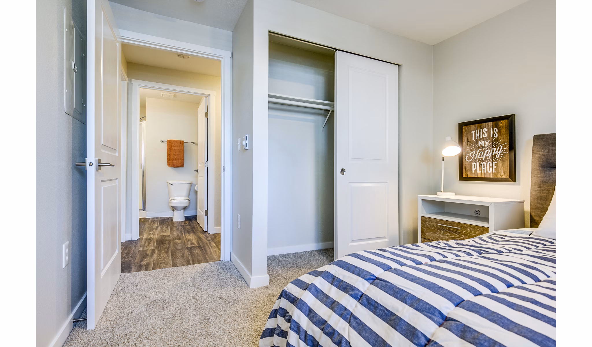 Cozy bedroom with modern furnishings at Callen Apartments, a Greystar luxury property