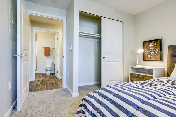 Cozy bedroom with modern furnishings at Callen Apartments, a Greystar luxury property
