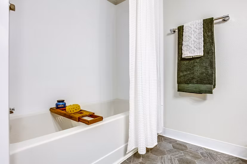 Luxurious bathroom with marble countertops and modern fixtures in Callen Apartments
