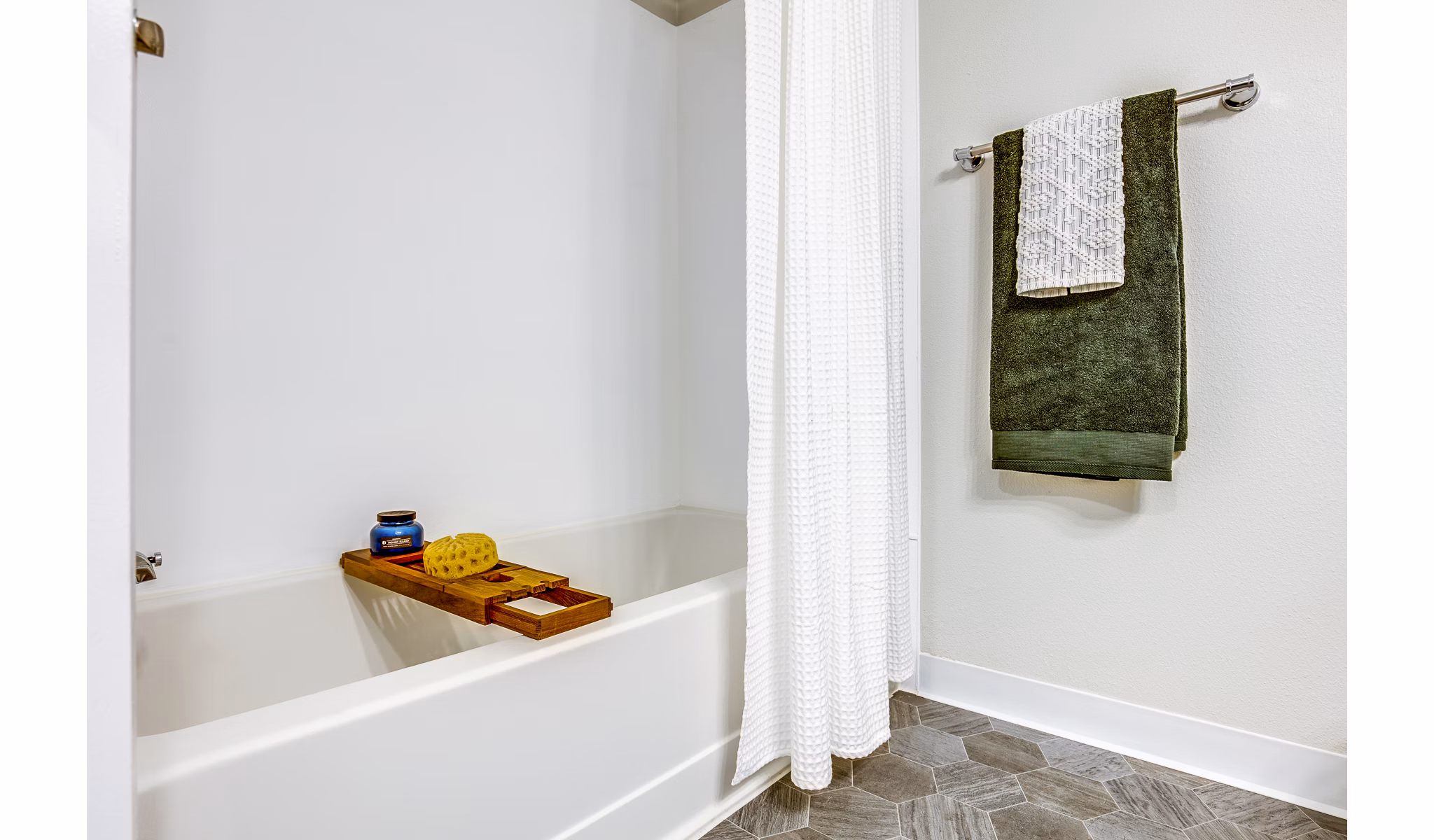 Luxurious bathroom with marble countertops and modern fixtures in Callen Apartments