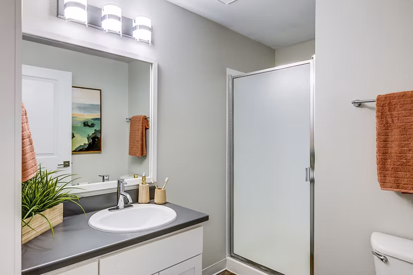 Bathroom featuring modern vanity and stylish fixtures at Callen Apartments' luxury apartment community