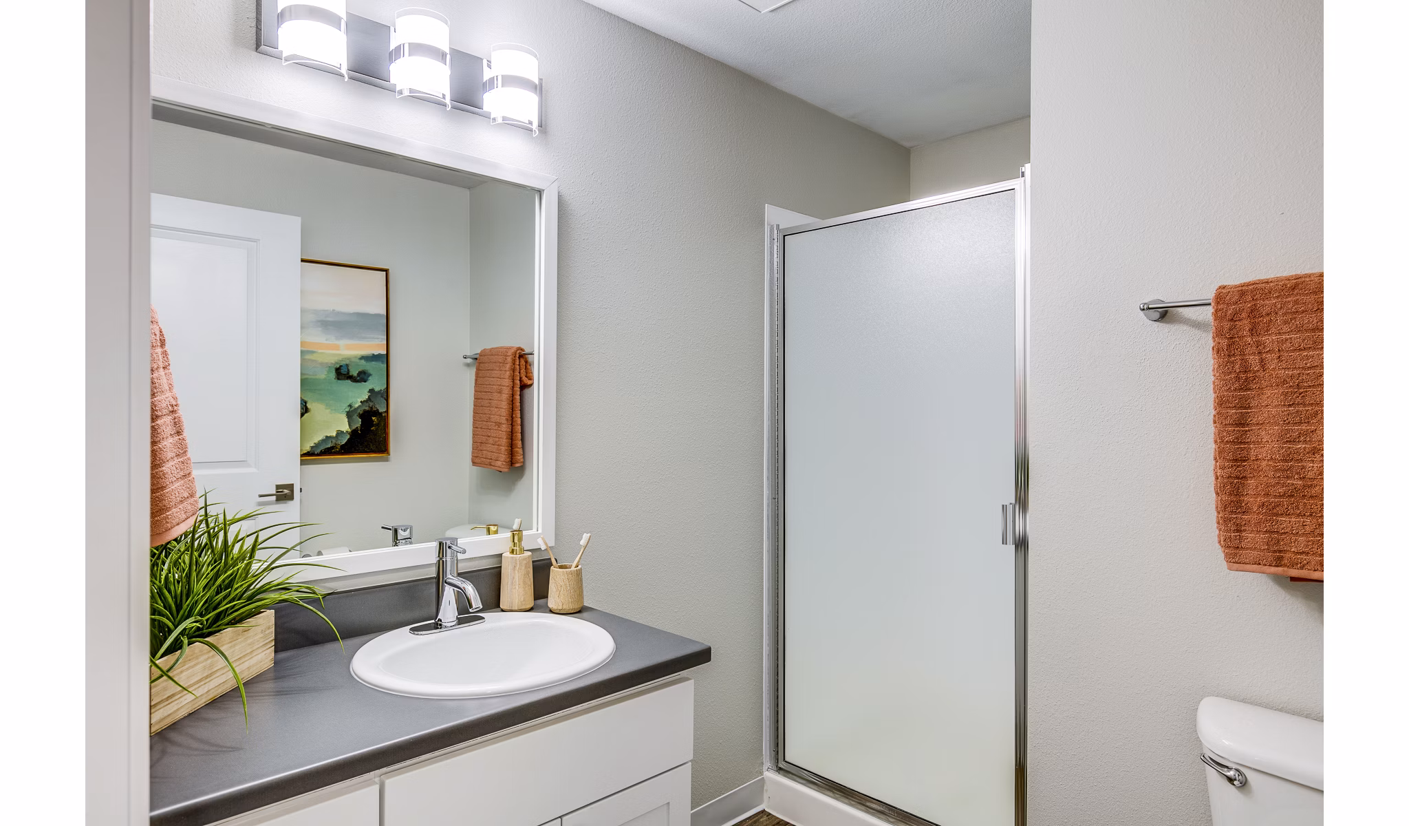 Bathroom featuring modern vanity and stylish fixtures at Callen Apartments' luxury apartment community