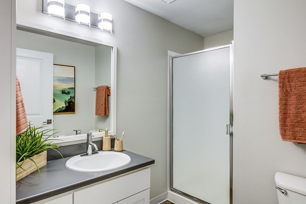 Bathroom featuring modern vanity and stylish fixtures at Callen Apartments' luxury apartment community