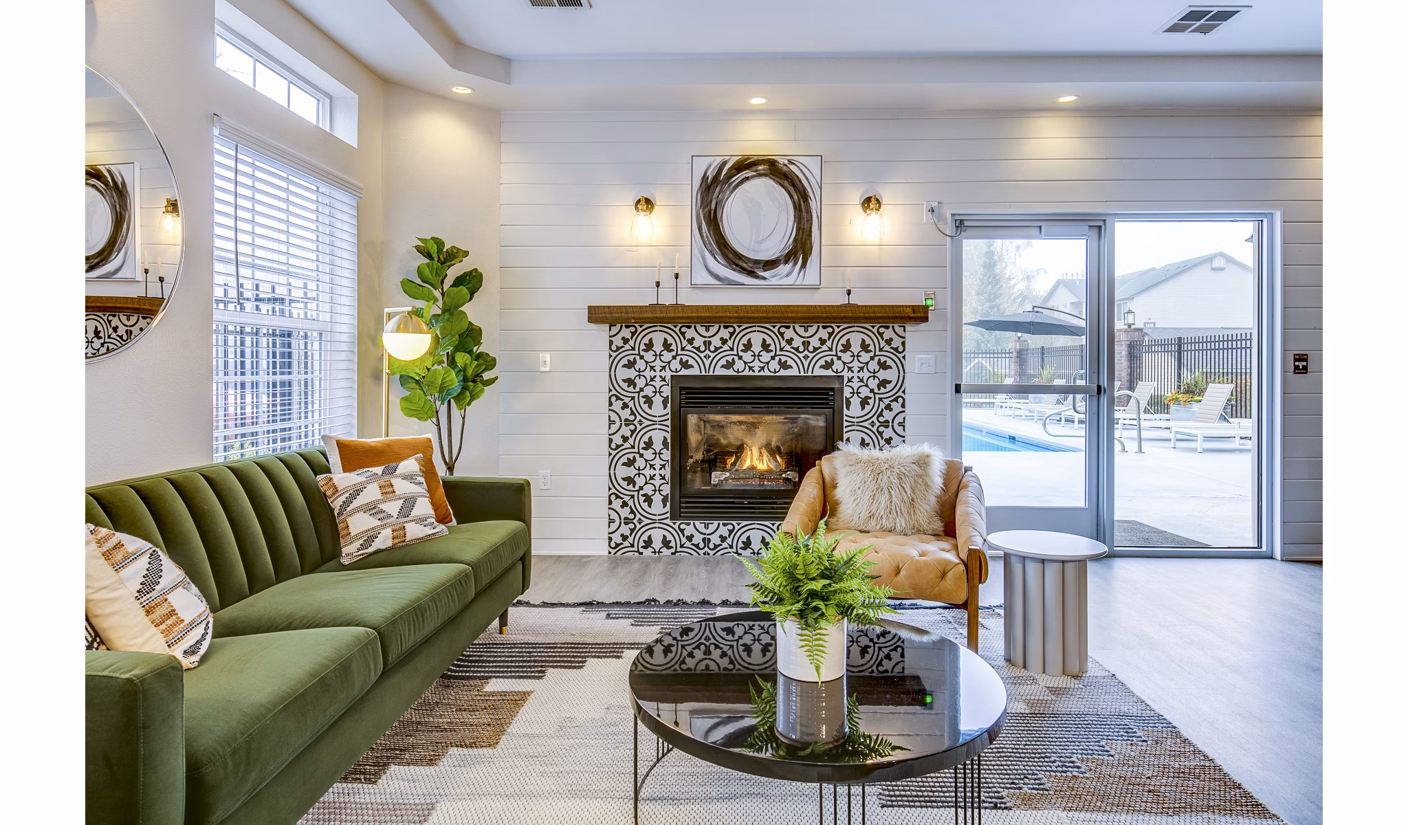 Clubhouse with modern seating and game tables at Callen Apartments, a luxury Greystar property