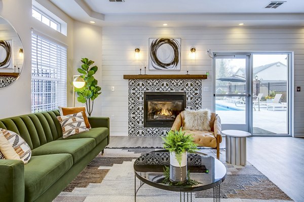 Clubhouse with modern seating and game tables at Callen Apartments, a luxury Greystar property