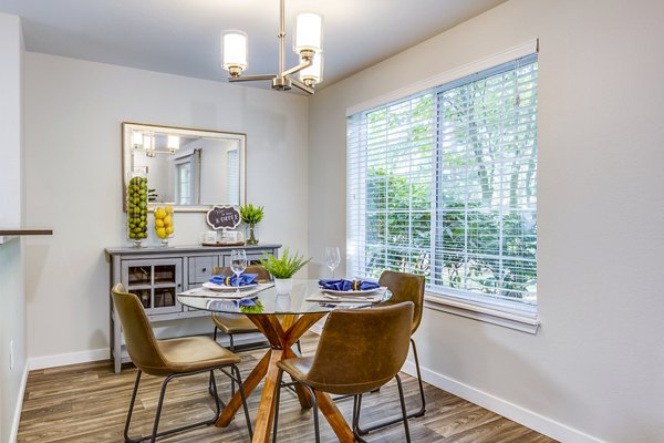 Dining room featuring modern furnishings and elegant lighting at Callen Apartments