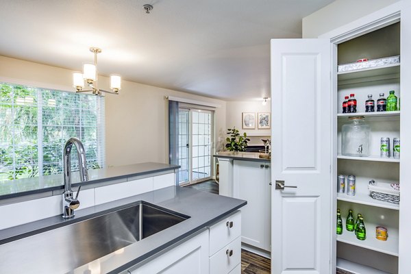 Modern kitchen with stainless steel appliances at Callen Apartments