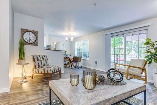 Spacious living room with modern decor in Callen Apartments