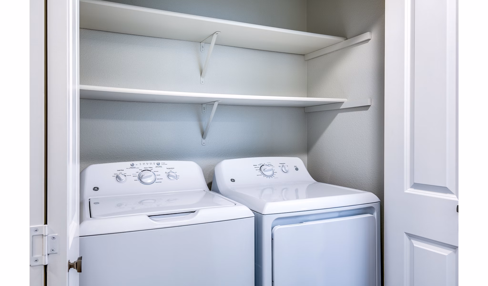 Laundry room with modern appliances at Callen Apartments in luxury Greystar community