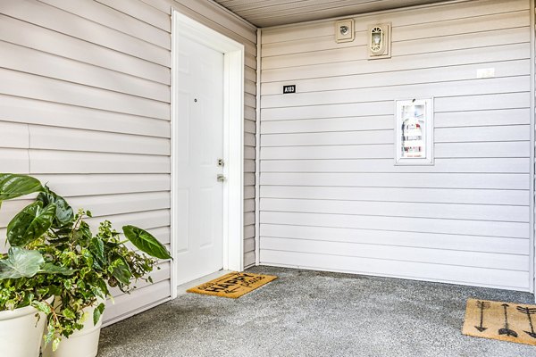 Inviting resident entrance and cozy patio at Callen Apartments, ideal for relaxing and social gatherings