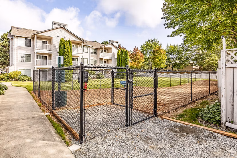 Dog-friendly park with play area at Callen Apartments