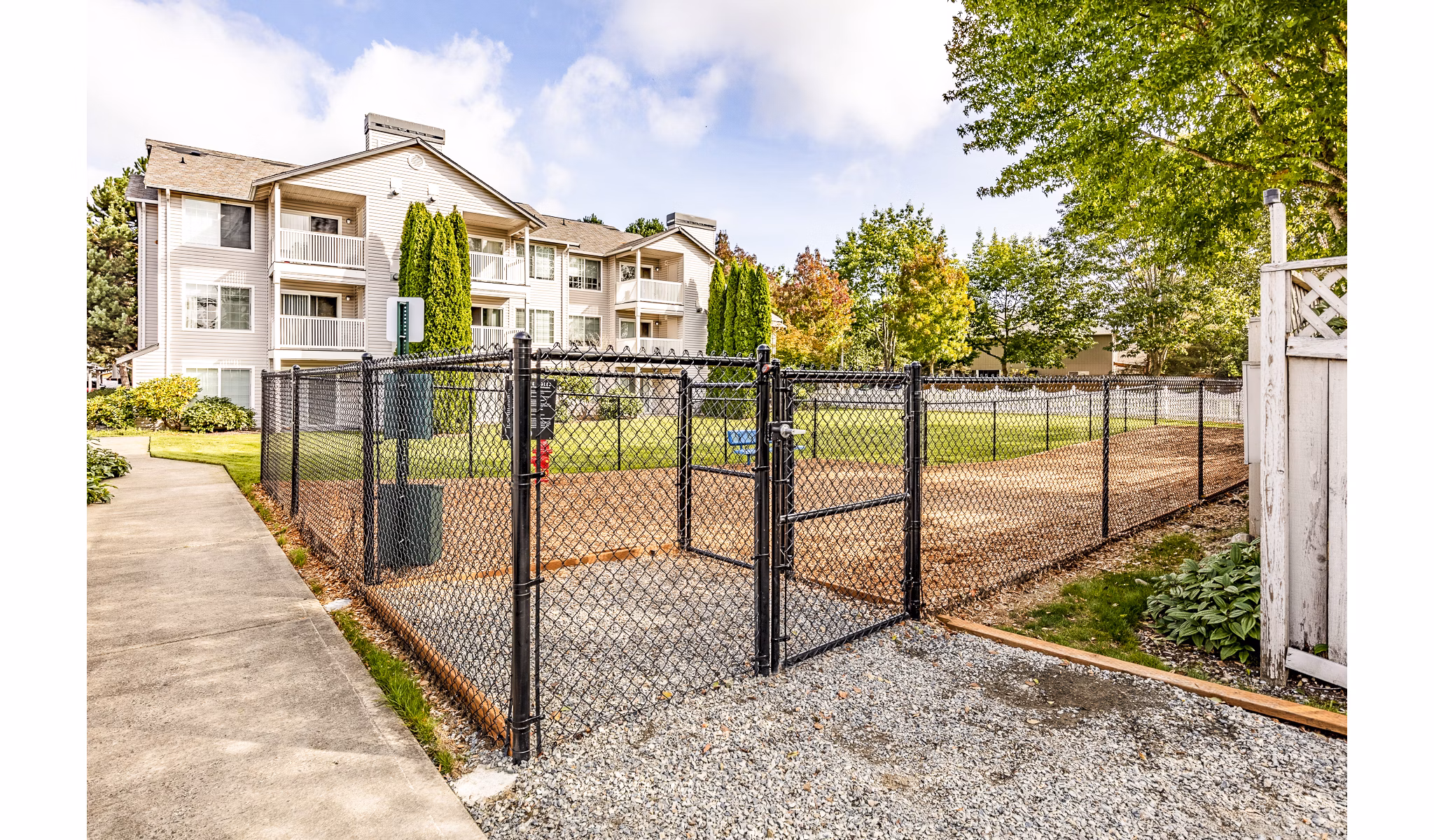 Dog-friendly park with play area at Callen Apartments