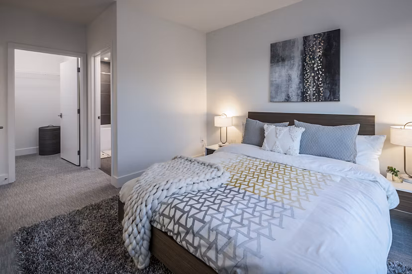 Bedroom featuring modern decor and natural light in Hyde Square Apartments