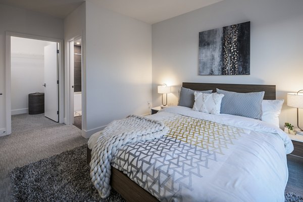 Bedroom featuring modern decor and natural light in Hyde Square Apartments