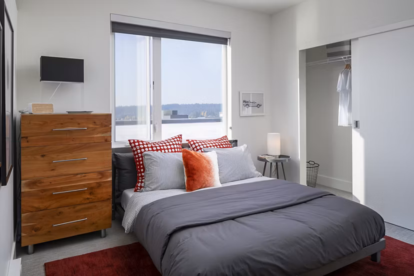 Cozy bedroom with modern decor at Hyde Square Apartments