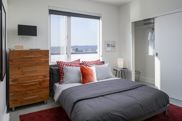 Cozy bedroom with modern decor at Hyde Square Apartments