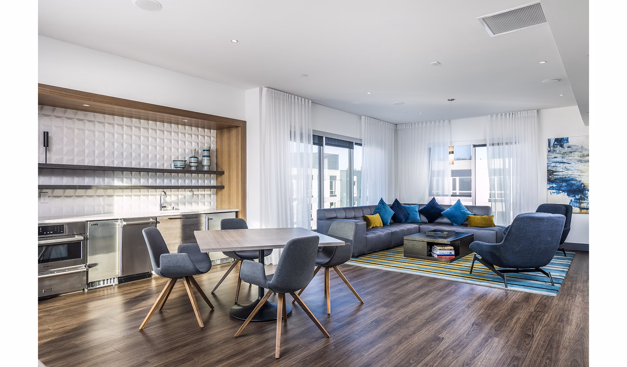 Clubhouse kitchen with modern appliances at Hyde Square Apartments offering luxury living