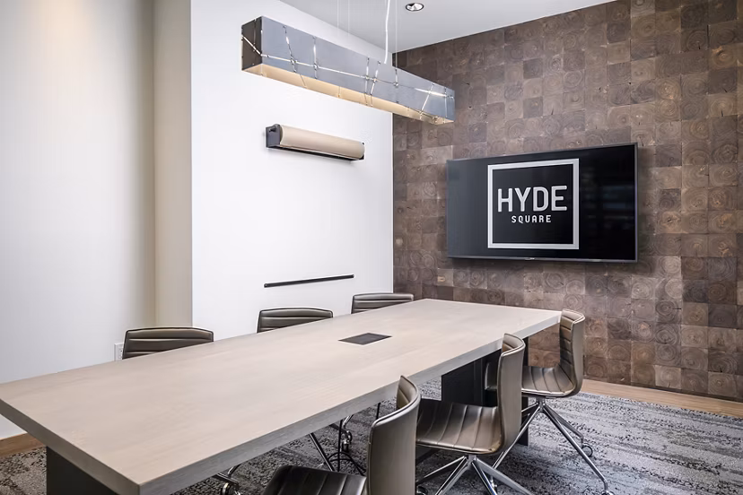 Modern meeting facility with sleek design at Hyde Square Apartments, featuring state-of-the-art technology for residents' convenience