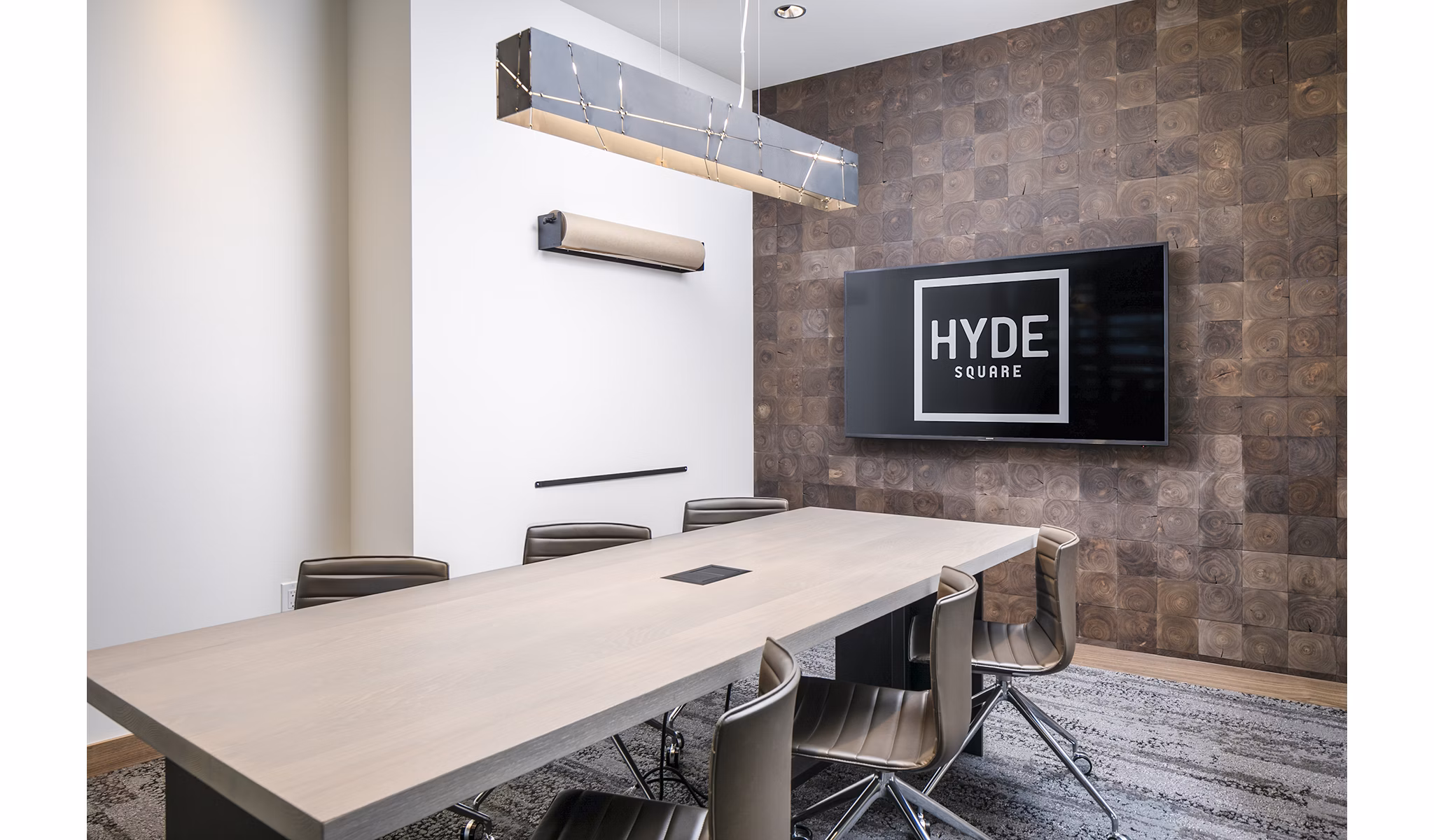 Modern meeting facility with sleek design at Hyde Square Apartments, featuring state-of-the-art technology for residents' convenience