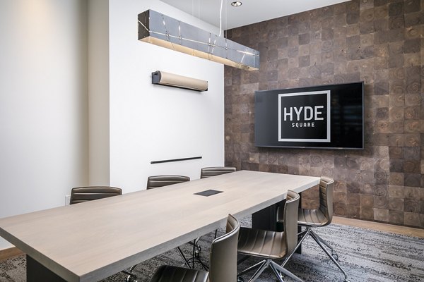 Modern meeting facility with sleek design at Hyde Square Apartments, featuring state-of-the-art technology for residents' convenience