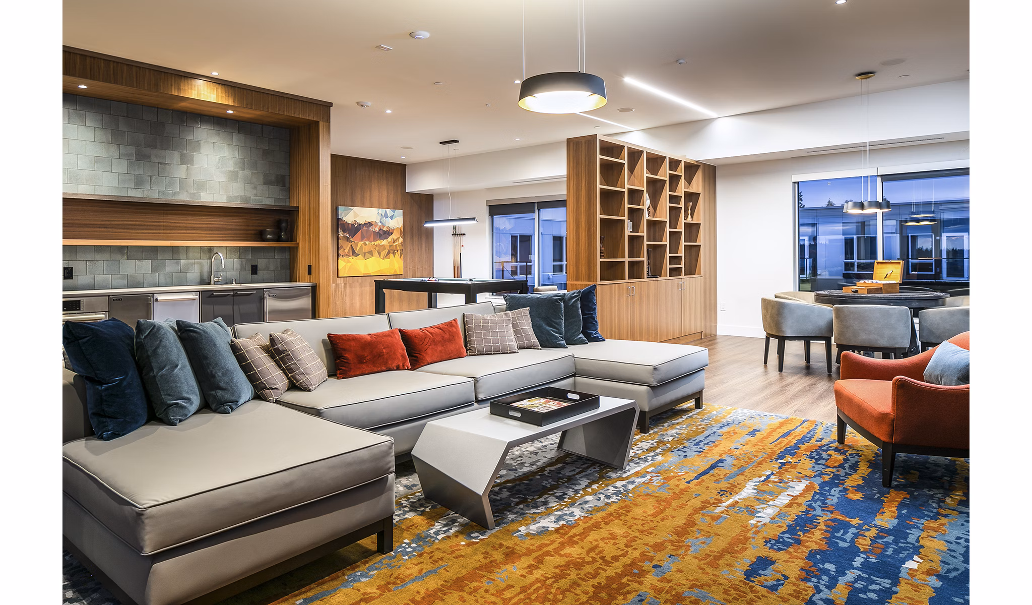 Game room with pool table and arcade games at Hyde Square Apartments