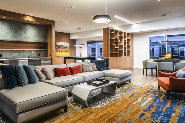 Game room with pool table and arcade games at Hyde Square Apartments