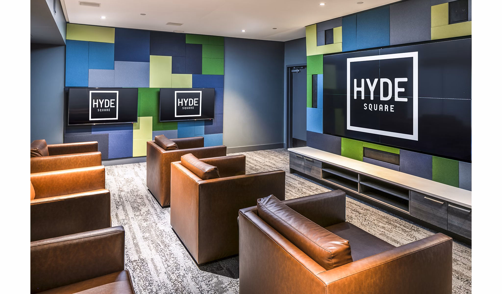 Clubhouse theater with plush seating and large screen at Hyde Square Apartments, perfect for entertainment and movie nights