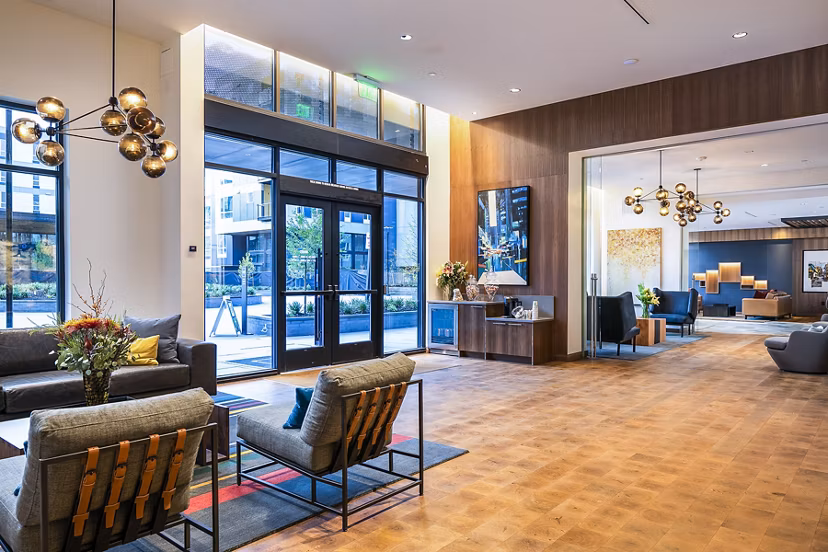 Elegant clubhouse lobby with contemporary decor at Hyde Square Apartments offering luxury amenities