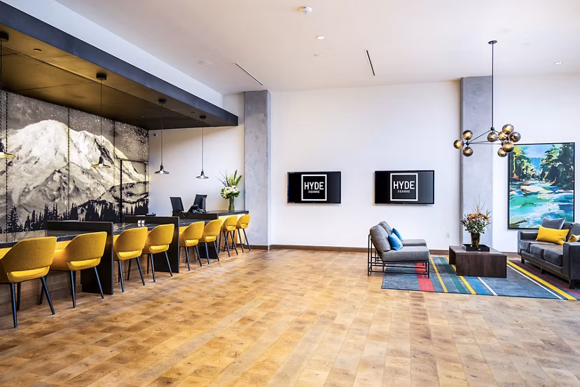 Welcoming leasing office with modern decor at Hyde Square Apartments