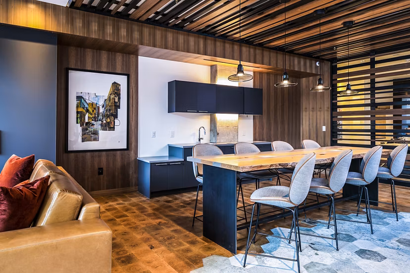 Clubhouse workspace featuring modern design and communal seating at Hyde Square Apartments