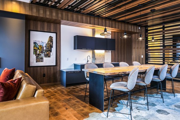 Clubhouse workspace featuring modern design and communal seating at Hyde Square Apartments