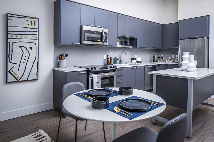 Dining room featuring modern decor and elegant lighting at Hyde Square Apartments