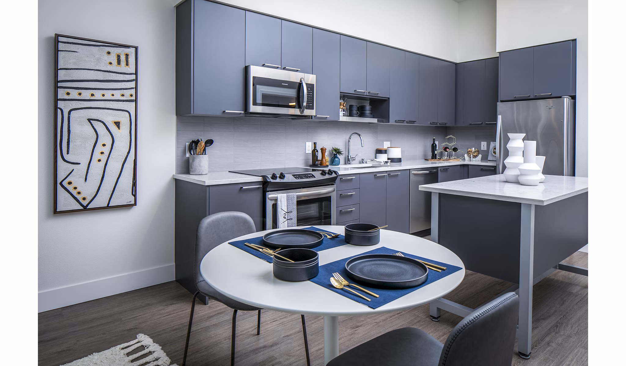 Dining room featuring modern decor and elegant lighting at Hyde Square Apartments